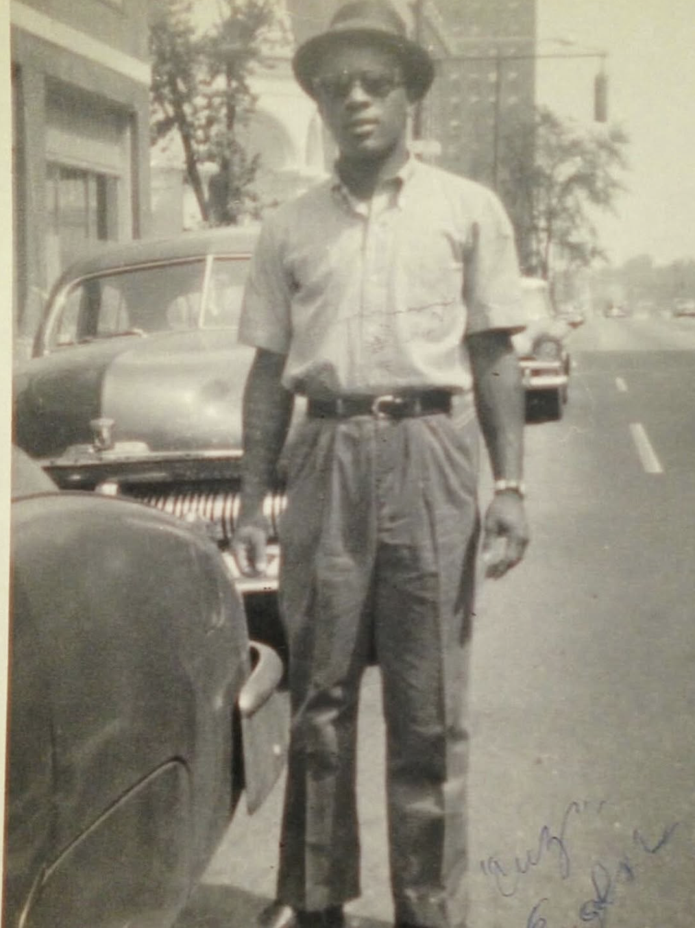 Eugene, founder of Eugene's Legacy Barbershop, photographed on a Richmond street in the 1960s